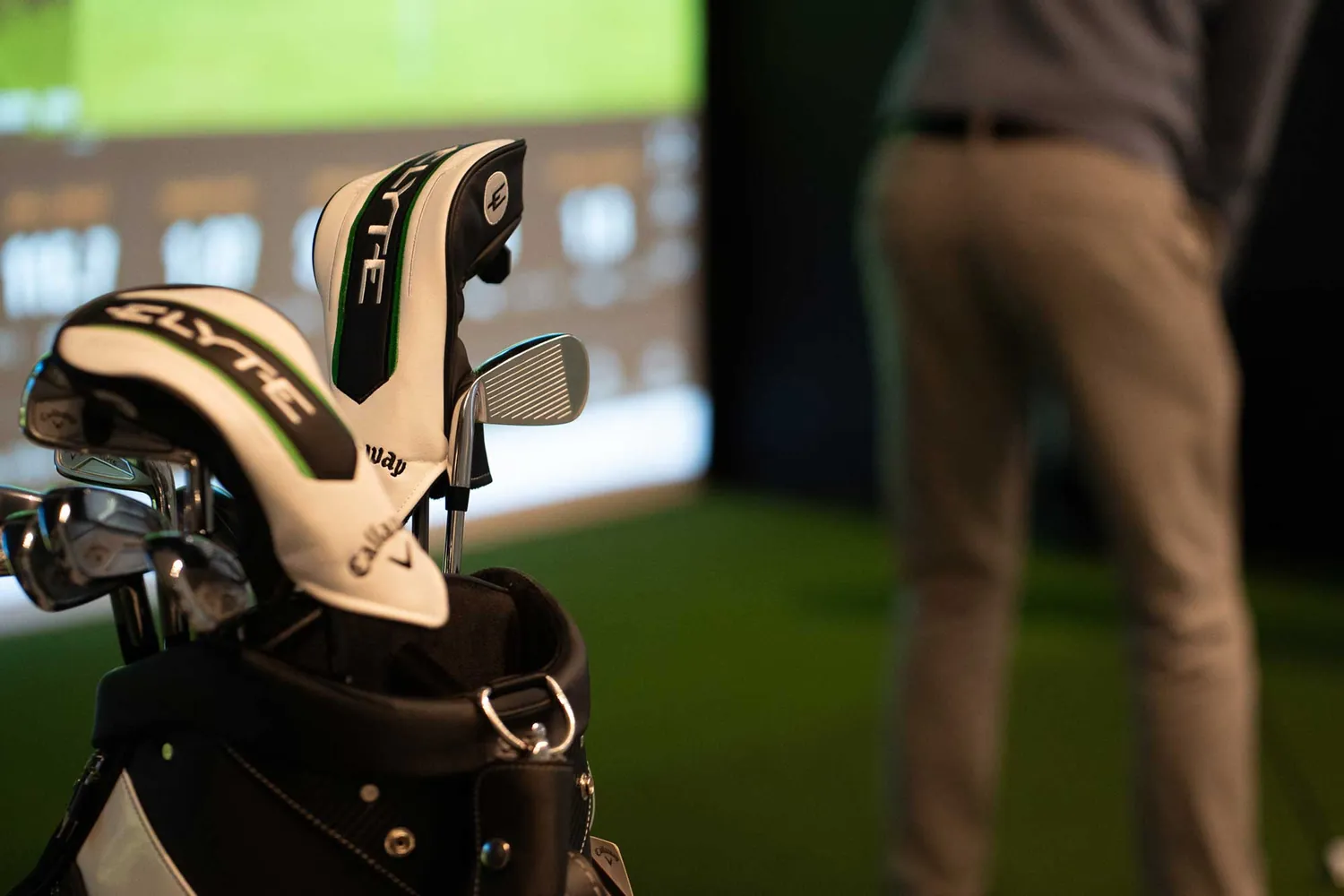 Callaway clubs and bag in a Trackman bay at Grip Golf